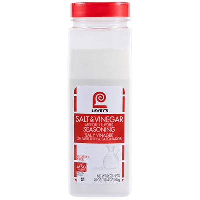 Lawry's Salt & Vinegar Seasoning bottle with salt and vinegar on a kitchen countertop.