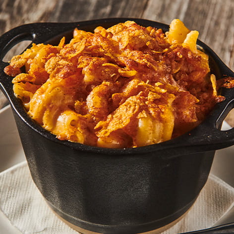 mac and cheese with nashville cornflakes and cheddar crispy. crusted toppings